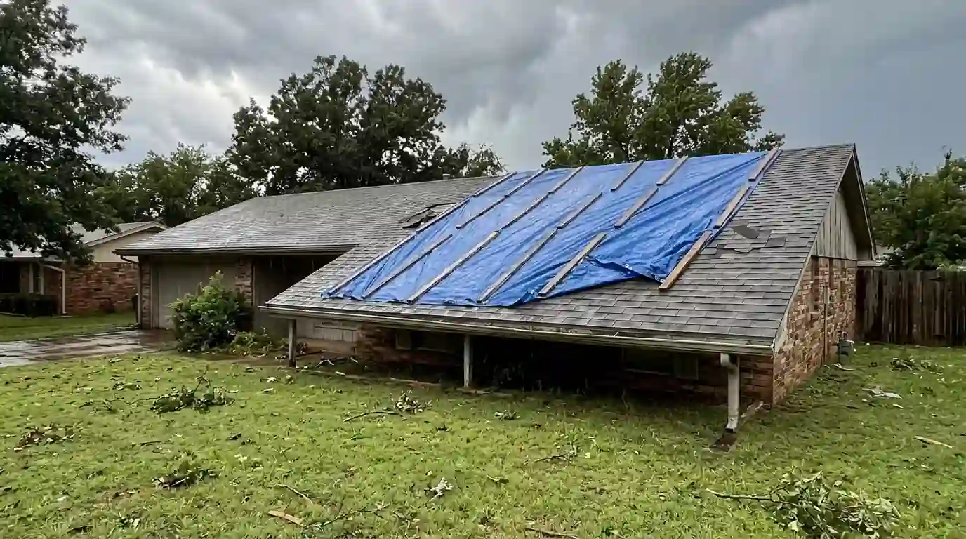 Battened tarp over storm damage on an Oklahoma City roof